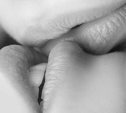 Lesbian kiss. Lips close up. Love and feelings. Homosexual couple. Two girls. Female kiss.