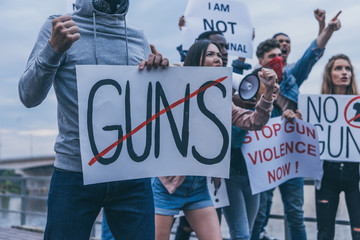 cropped view of multicultural people holding placards with letters