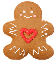 Christmas Gingerbread man biscuit with red heart icing isolated on white background