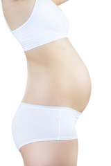 Side view on pregnant woman in the early stages of pregnancy.
