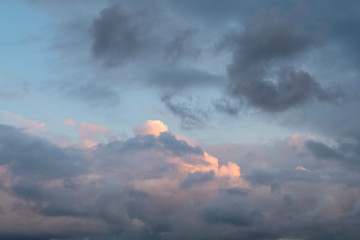 Cloudy sky background. Black clouds Black clouds are approaching white and black cloud surface at sunset. 