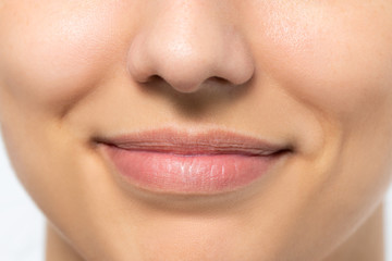 Macro detail of woman with charming smile.