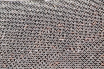 A Fish Scale Design Slate Tiles House Roof. © daseaford