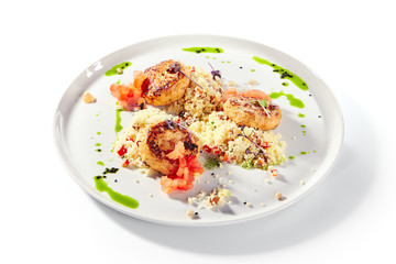 Turkey Meat Cutlets with Couscous Garnish on White Plate Isolated