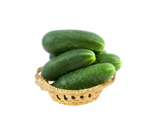 Cucumbers in a basket on a white background