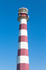 Evpatoria lighthouse against the blue sky in the village of Zaozernoye, Saki district, Crimea