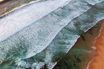 Aerial top shot from ocean waves at the atlantic ocean