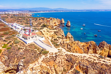 Aerial from natural rocks and the lighthouse at Ponte Piedade in Lagos Portugal