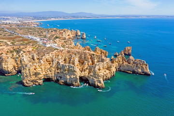 Aerial from natural rocks and the lighthouse at Ponte Piedade in Lagos Portugal