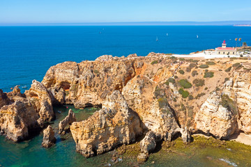 Aerial from natural rocks and the lighthouse at Ponte Piedade in Lagos Portugal