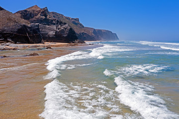 Aerial from the beach and ocean at Praia Vale Figueiras in Portugal