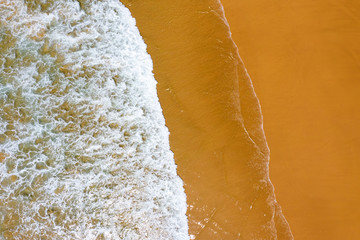 Aerial top shot from ocean waves at the beach