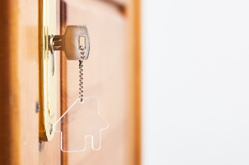 A key in a lock with house icon on it