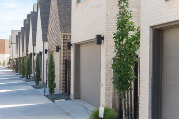 Clean and empty back alley of brand new row houses near downtown Dallas