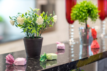 Decorative elements on the rack. Flowers and sweets.