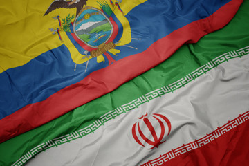 waving colorful flag of iran and national flag of ecuador.