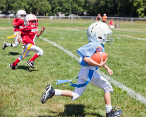 Unidentifiable kids playing flag American football - 286293645