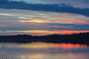 Fototapeta na wymiar Sunsen on small lake near Saint-Petersburg, Russia