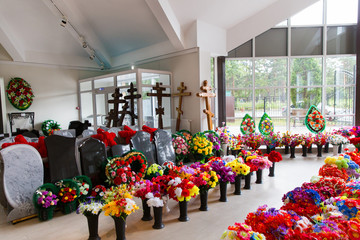Sale of funeral accessories. Shop selling coffins, funeral wreaths and flowers