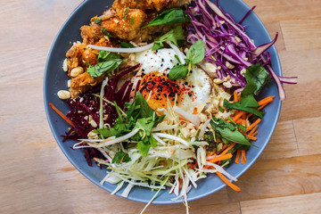 Rich asian meal with vegetable,chicken and egg.