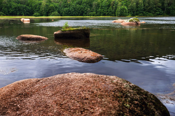 Boulders in pond.