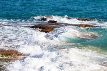 WAVES OF SEA ARRIVING ON THE SHORE IN THE ATLANTIC SEA ON THE COAST OF CADIZ IN SPAIN