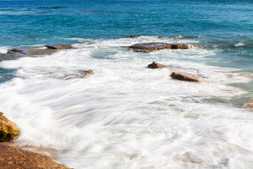 WAVES OF SEA ARRIVING ON THE SHORE IN THE ATLANTIC SEA ON THE COAST OF CADIZ IN SPAIN