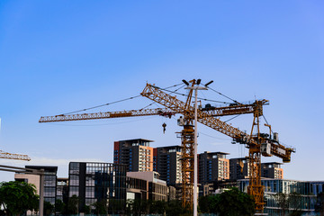 Fototapeta premium cranes visually crossed at a residential complex construction site in shenzhen, china