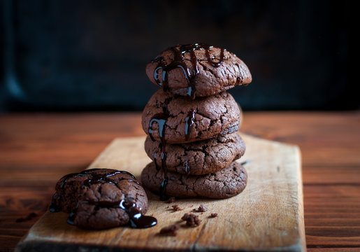 Close-up of homemade chocolate cookies on wooden background