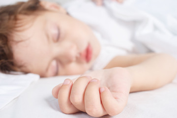 little girl sleeps in bed. Baby sleep concept. Selective focus.