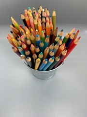 colored pencils in cup