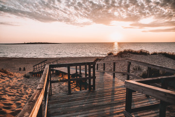 Fototapeta na wymiar Tree deck on Swedish beach during sunset