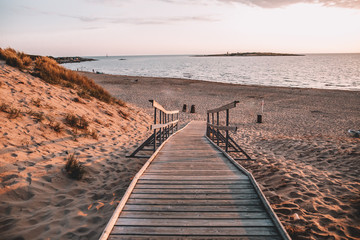 Fototapeta premium Tree deck on Swedish beach during sunset