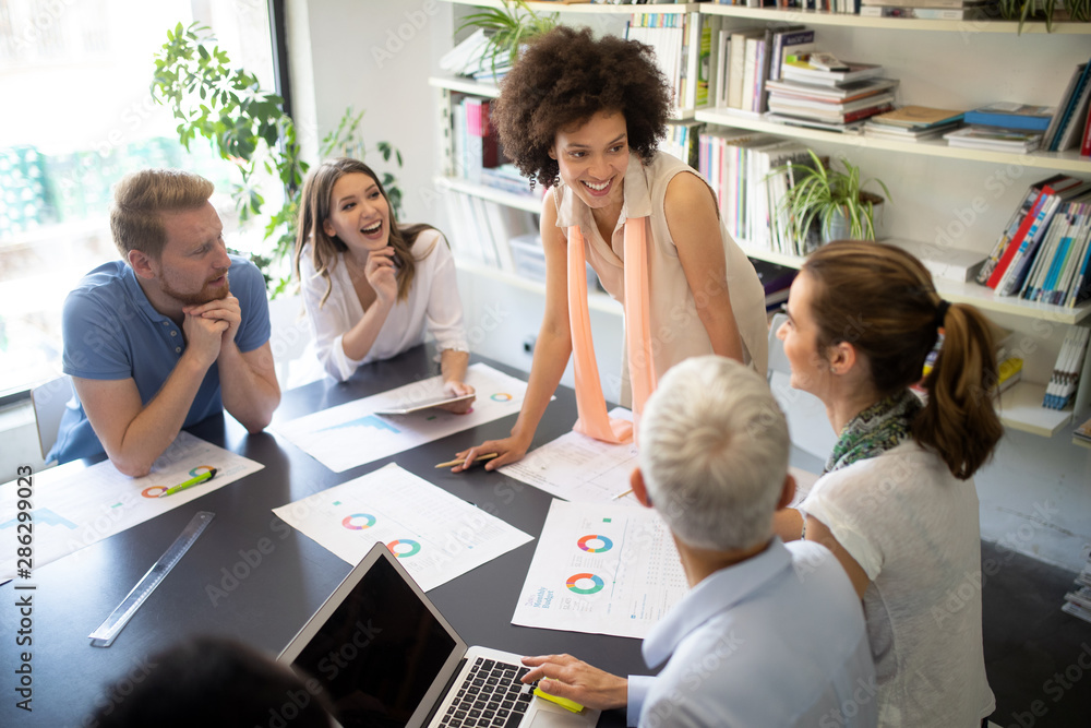 Wall mural successful group of business people at work in office