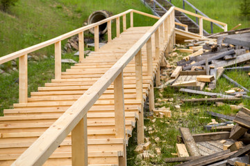 New wooden stairs outdoors. Carpenters work.