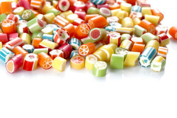 group of colored candies isolated on white background