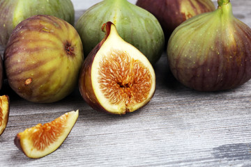 Fresh figs. Food Photo. whole and sliced figs on rustic background.