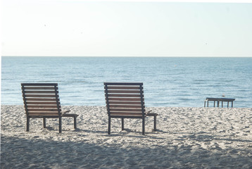 lonely bench by the sea on a summer morning