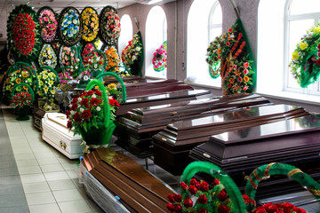 Shop selling coffins and funeral wreaths. Sale of funeral accessories