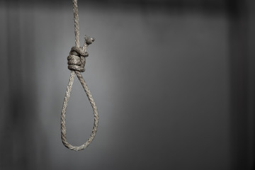 commit suicide concept, Hangman's noose knot in dark room. - obrazy, fototapety, plakaty