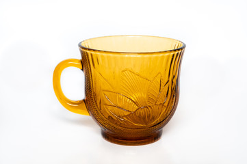 golden orange tea cup isolated on white background