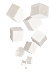 Falling cubes of soft cheese isolated on white background. Feta