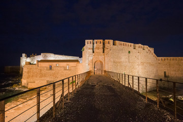 Night view of the fortress in defense of the island of Ortigia in Syracuse, in Sicily Italy.