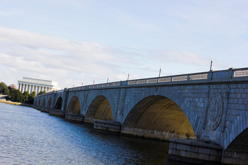 View of the ceremonial Arlington Memorial Bridge spanning the Potomac River with the Abraham Lincoln Memorial behind