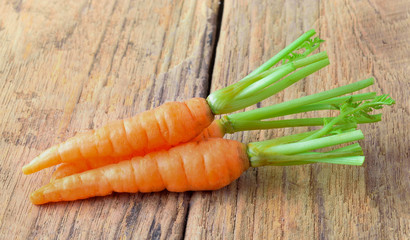 Carrots on a wooden background