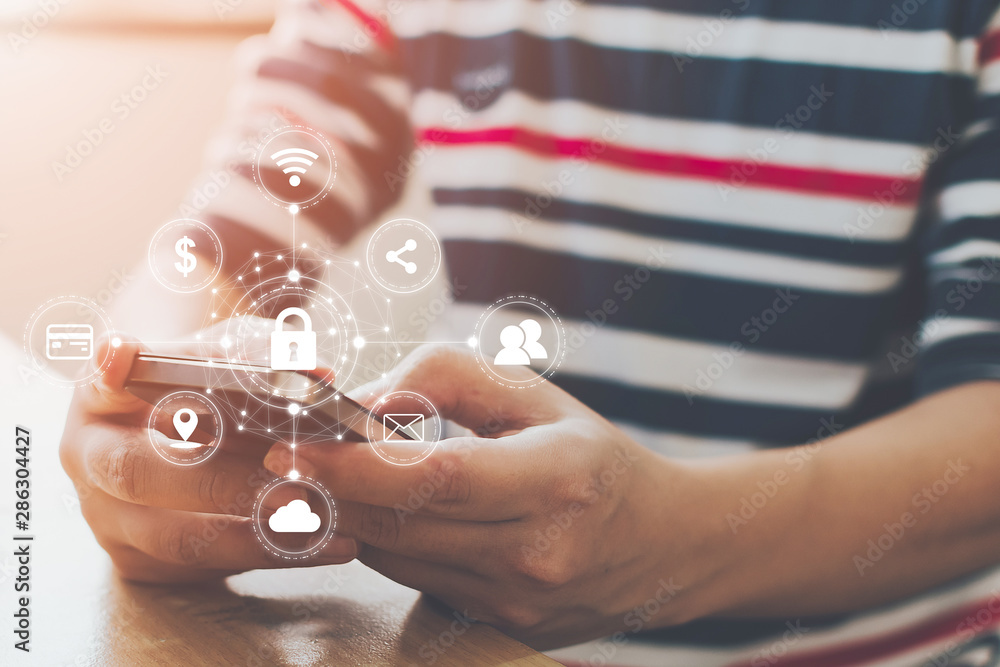 Poster close-up image of male hands using mobile smartphone with icon graphic cyber security network of con
