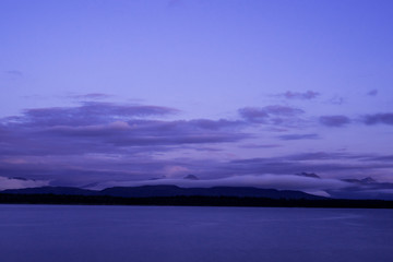 Landscape of mountains coming out from the sea in Molde, a beautiful view from of the fjord.