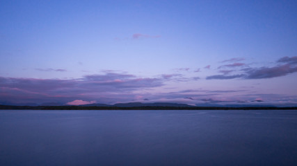 Landscape of mountains coming out from the sea in Molde, a beautiful view from of the fjord.