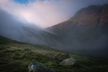 Cloud rolling in across a lake