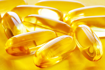 Omega 3 fish oil yellow soft gel capsules.